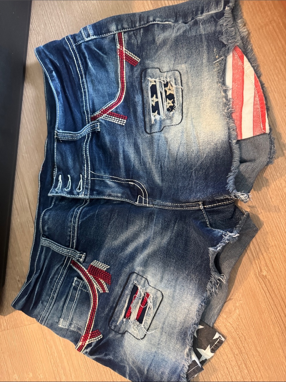 Women's Distressed Blue Denim Jean Shorts with Flag Patch Detail